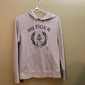 Tommy Hilfiger grey hooded sweater with black logo and kangaroo pocket.